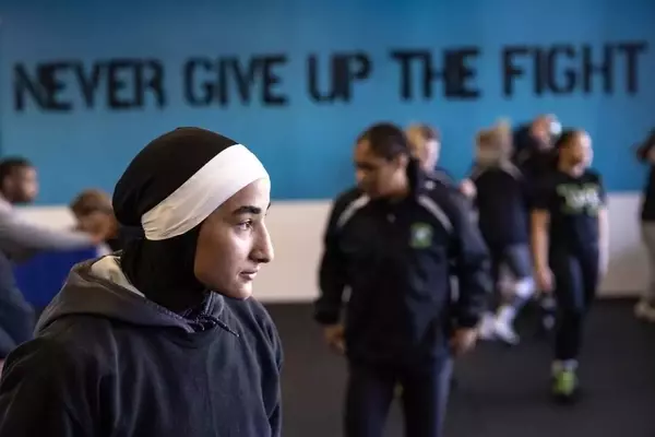 Sisters Revolutionize Women's Wrestling with Faith-Based Uniforms