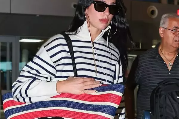 Dua Lipa Redefines Airport Chic with Oversized Chanel Tote
