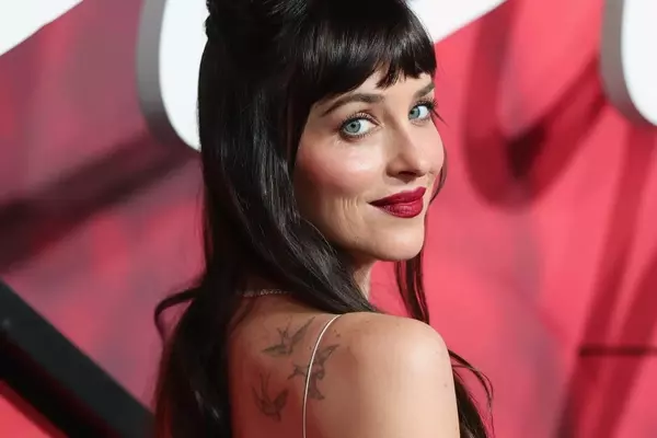 Dakota Johnson Revives Precision Red Lip at "Verity" Premiere